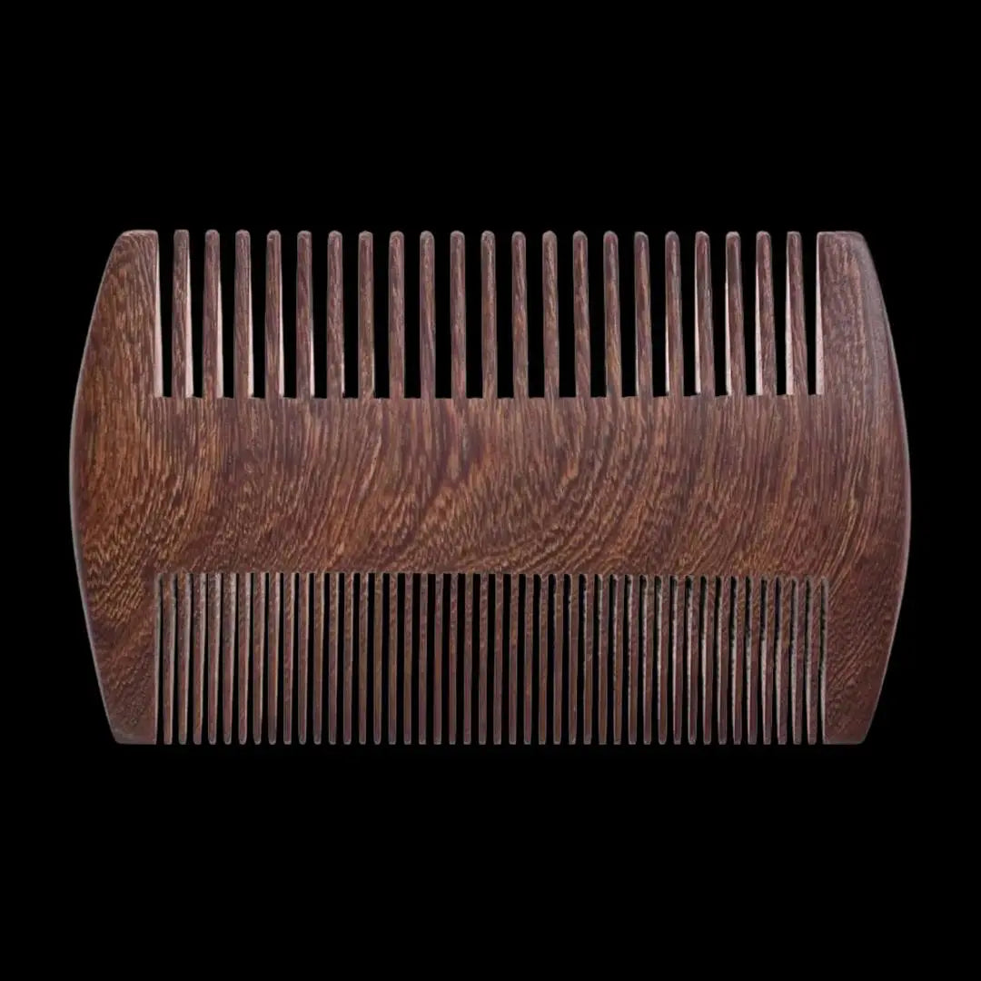 Custom engraved wood beard comb by Winks Design Studio, LLC, showing detailed wood grain and engraved design on the comb.