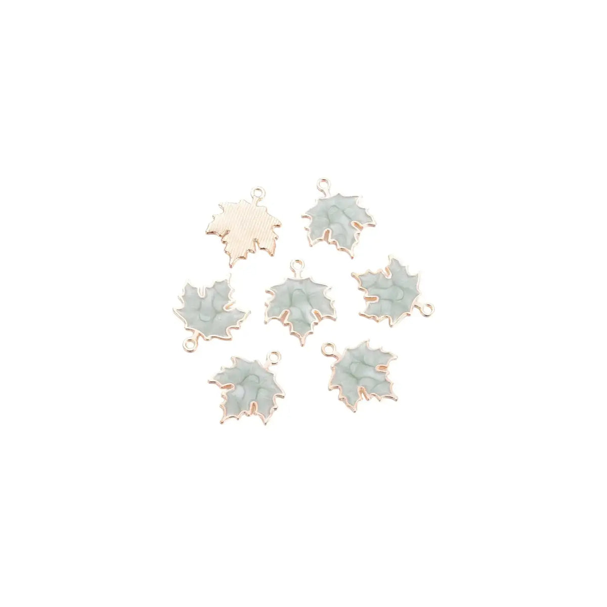 Gold marbled leaf charm by Winks Design Studio, LLC, featuring a detailed leaf design with gold and marbled finish.