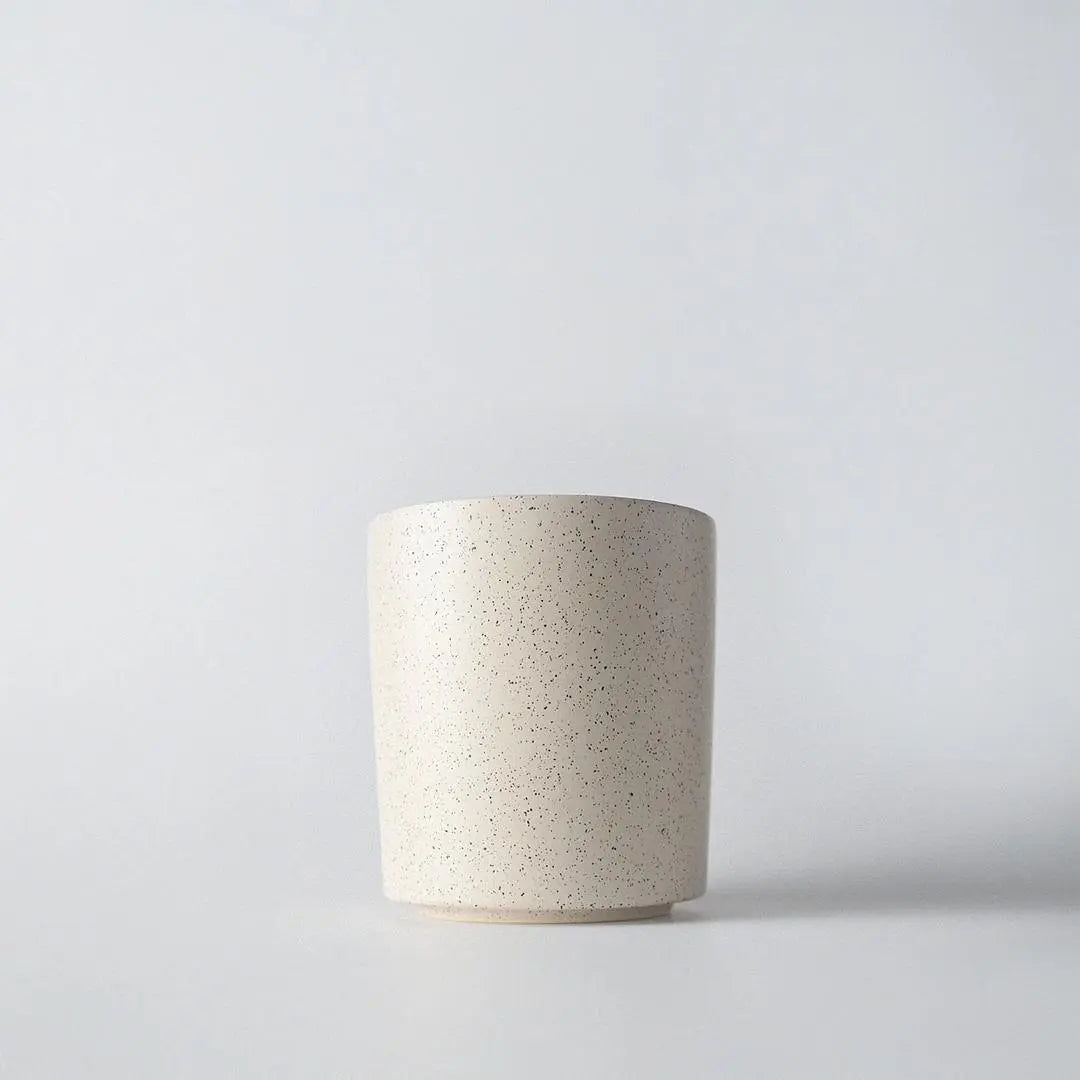 Earth & Ember Luna & Lux 13 oz candle by Winks Design Studio, LLC, featuring a sleek glass container and a lit natural wax flame.