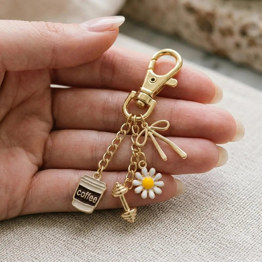 Gold Dumbbell Charm from Winks Design Studio, LLC, showcasing a detailed miniature fitness-themed jewelry charm.