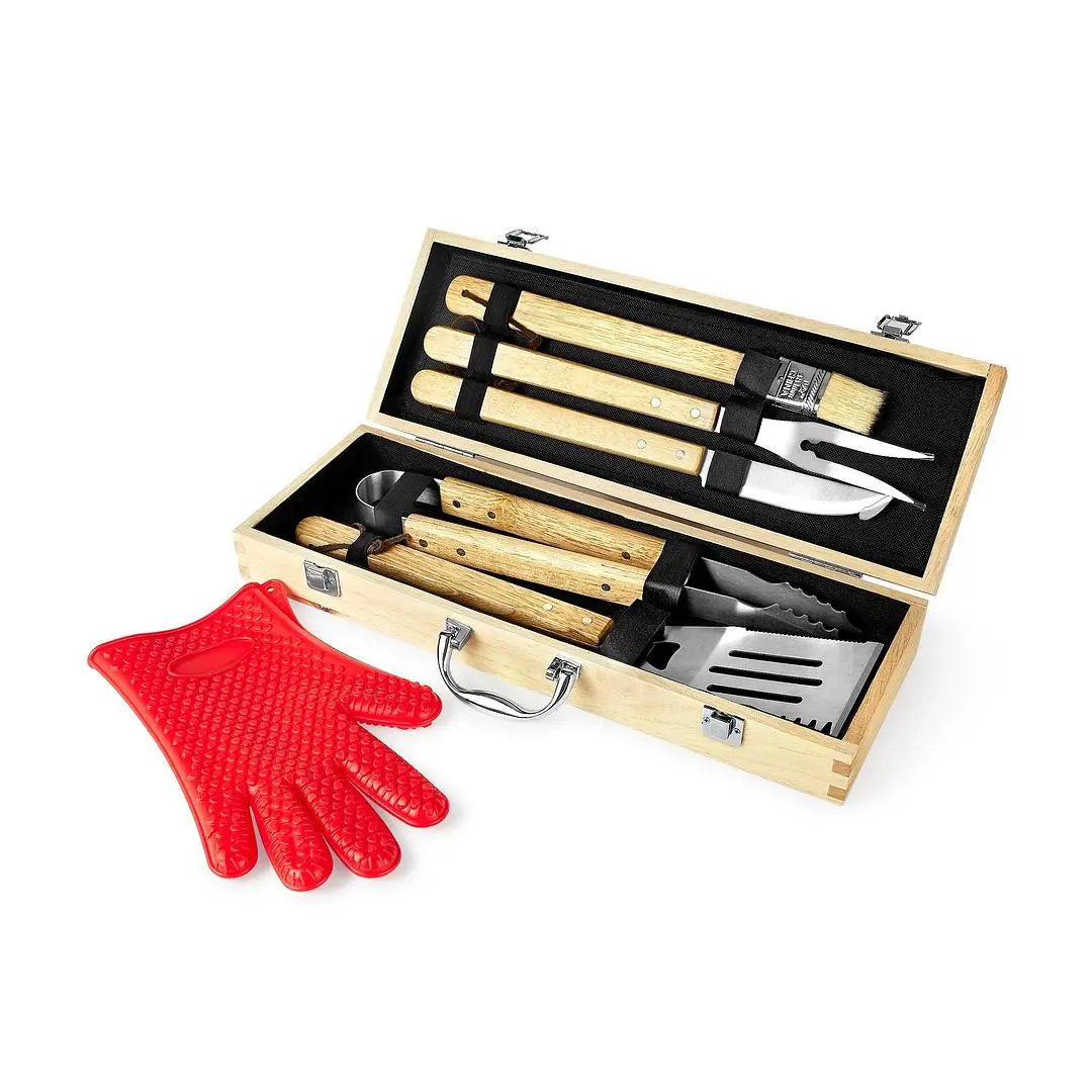 Custom engraved Winks Design Studio 11-piece BBQ grill set with tongs, spatula, forks, and brushes on a wooden surface.