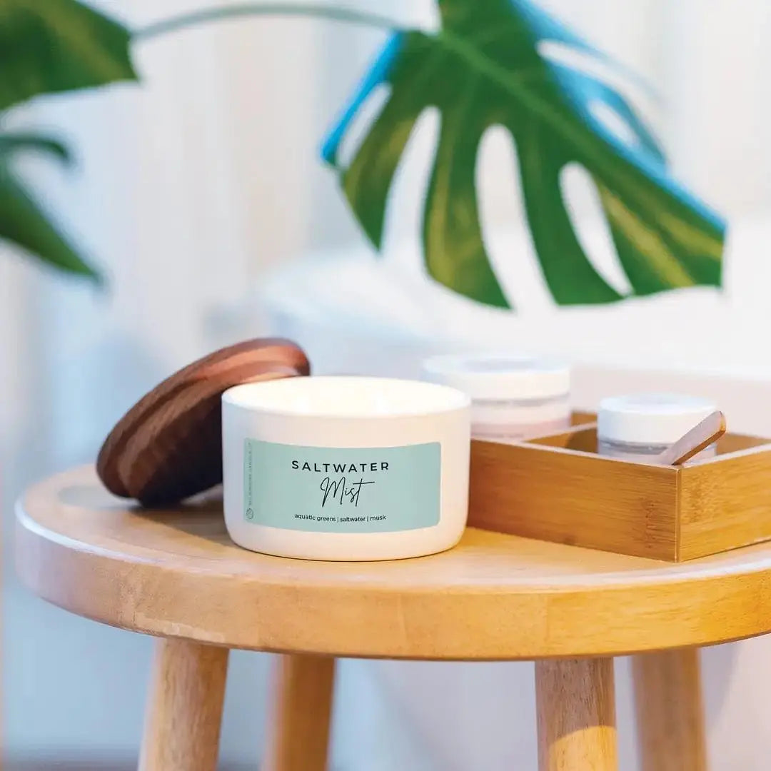 Winks Design Studio LLC Milkhouse Candle 10oz Saltwater Mist scented candle with a glass jar and white wax inside.