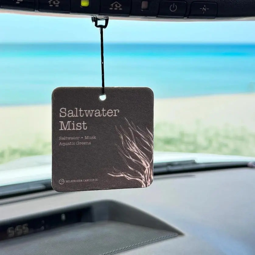 Winks Design Studio Milkhouse Candle Co. Car Freshener in Saltwater Mist scent, hanging with a sleek design and refreshing fragrance.
