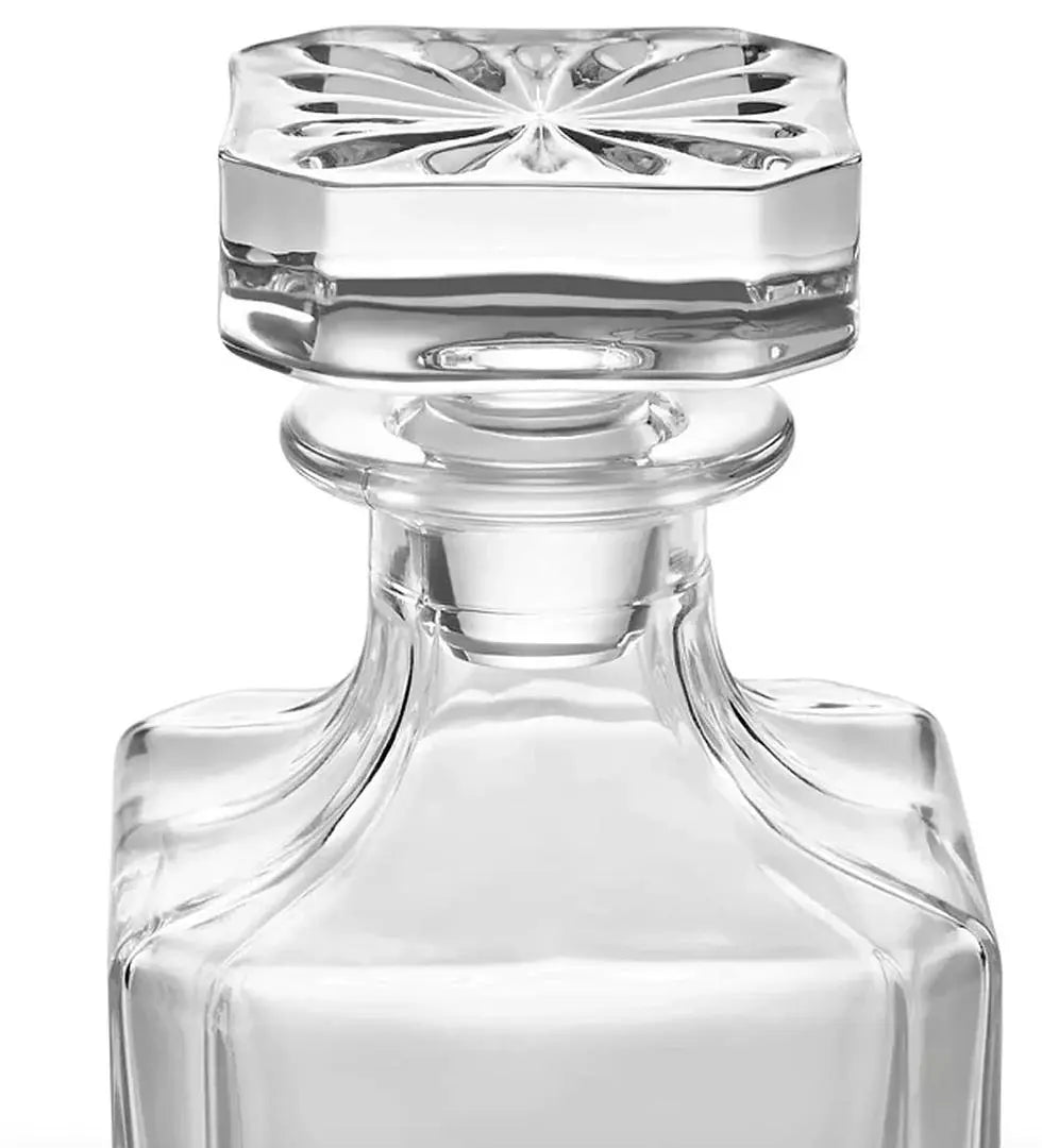 Custom engraved glass decanter from Winks Design Studio, LLC, with a sleek, clear glass design and personalized engraving detail.