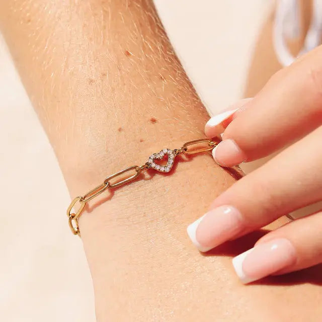 18K gold heart paperclip chain bracelet by Winks Design Studio, LLC, featuring a delicate heart-shaped charm and sleek paperclip links.