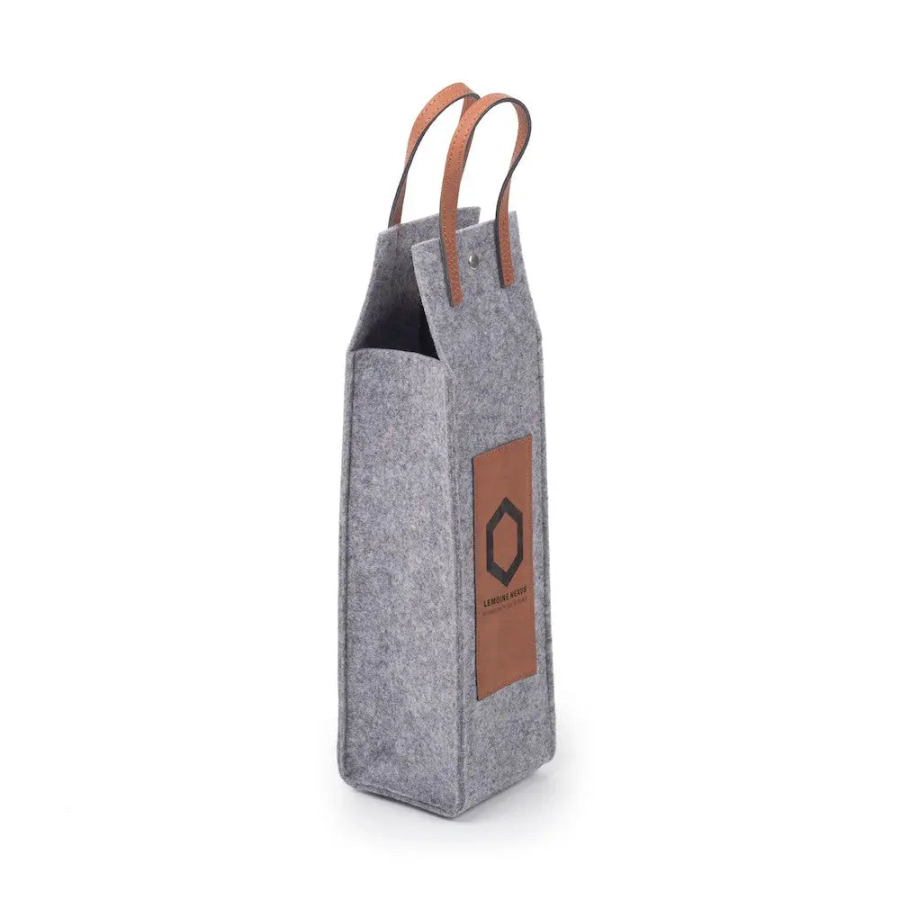 Custom leather flannel wine tote by Winks Design Studio, LLC, showing a stylish, handcrafted wine carrier with leather and flannel materials.