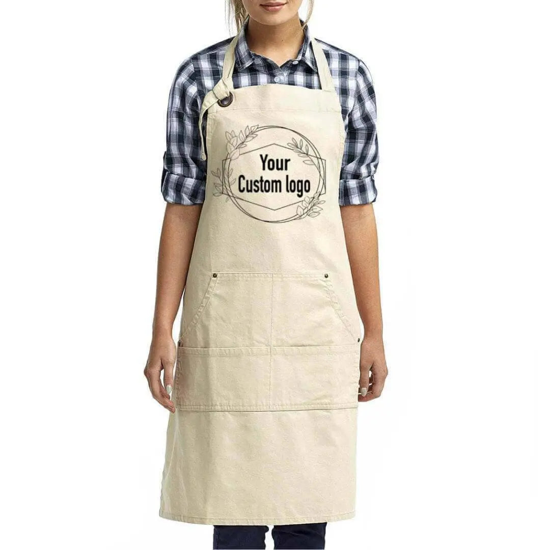Black custom canvas artisan bib apron by Winks Design Studio, LLC, featuring a durable design with adjustable neck straps.