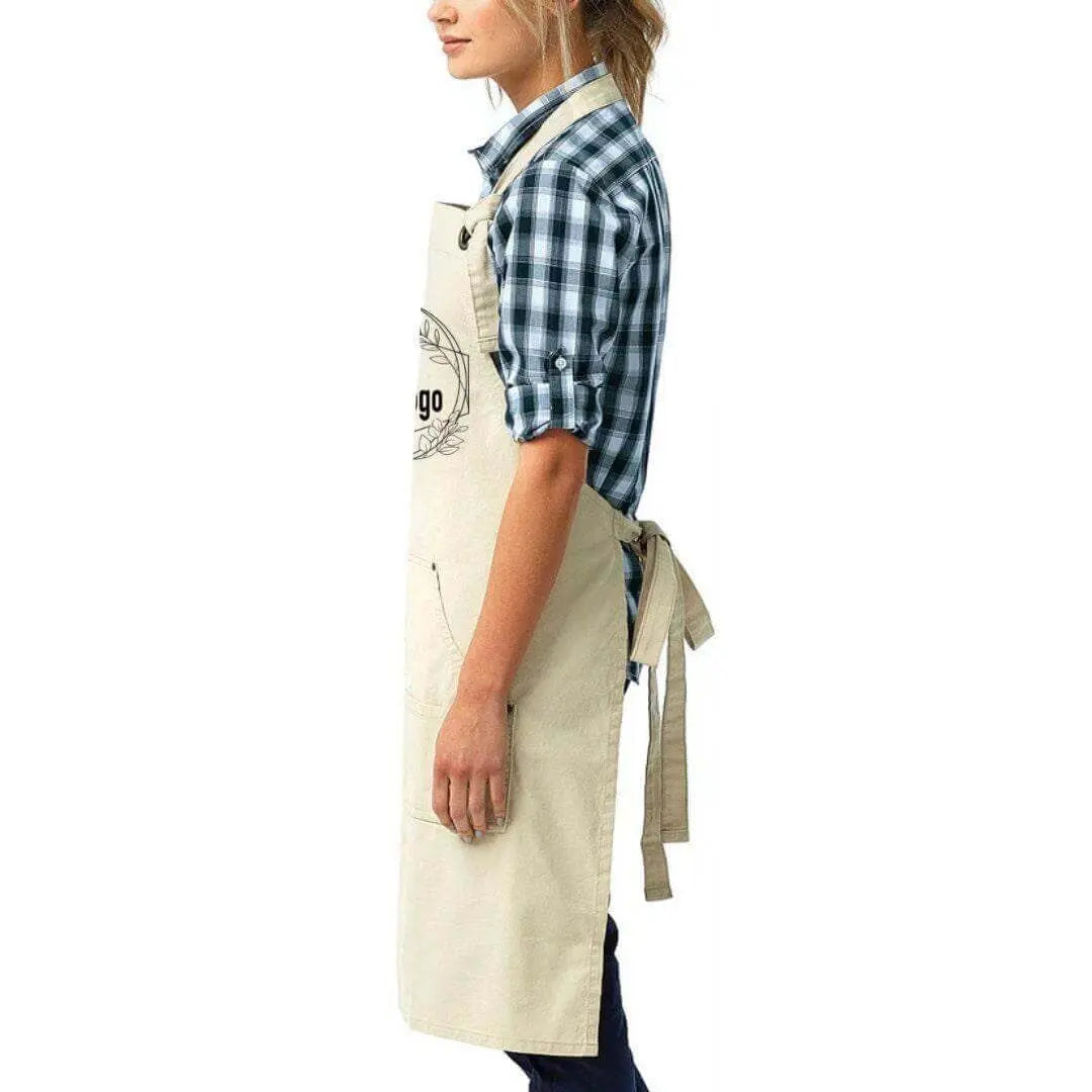 Black custom canvas artisan bib apron by Winks Design Studio, LLC, featuring durable fabric and professional craftsmanship.