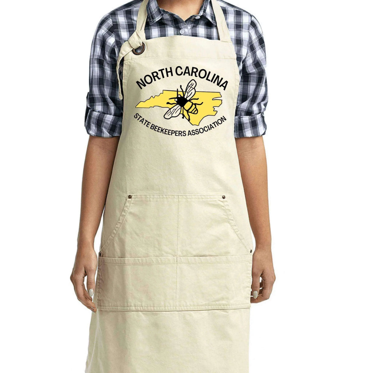 Black NCSBA Pocketed Apron by Winks Design Studio, LLC with multiple front pockets and adjustable neck strap for versatile use.
