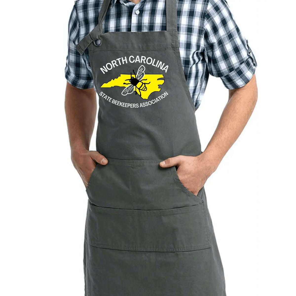 Black NCSBA Pocketed Apron by Winks Design Studio, LLC with multiple front pockets and adjustable neck strap.