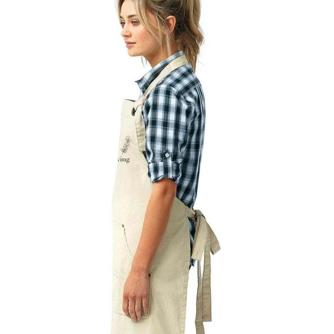 Winks Design Studio LLC Keep Going Keep Growing apron with motivational text, made of durable fabric, ideal for cooking or craft activities.