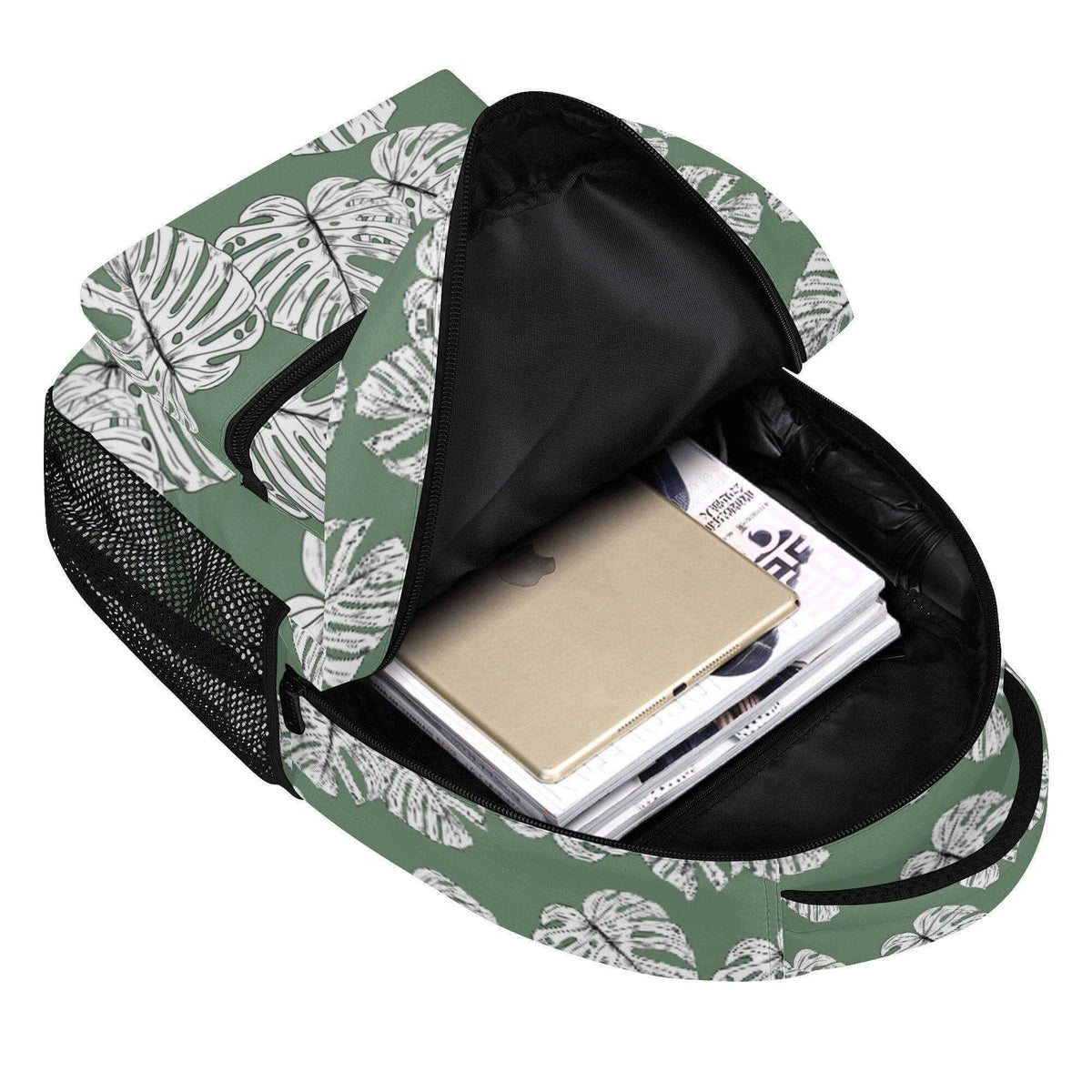 Green Monstera Leaves Backpack by Winks Design Studio, LLC featuring vibrant tropical leaf pattern and sturdy shoulder straps.
