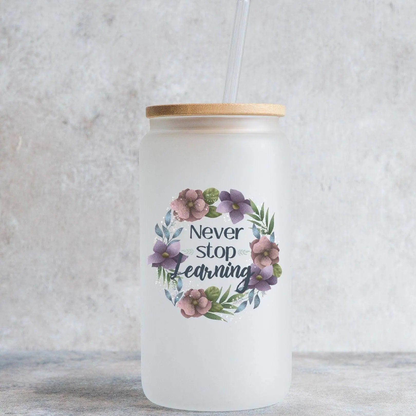 Winks Design Studio LLC 16oz glass beer can with "Never Stop Learning" text, clear glass with a cylindrical shape.