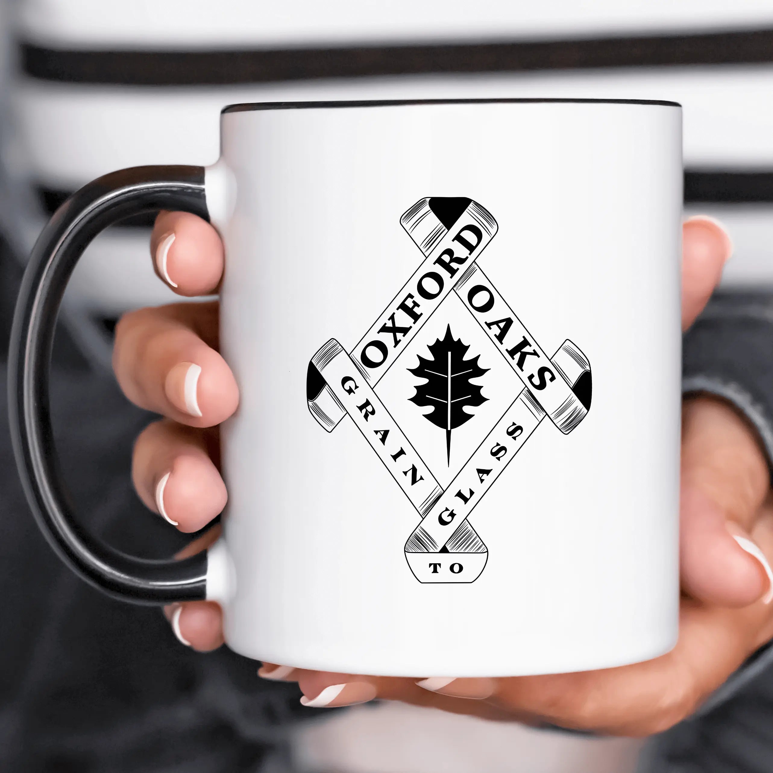 Winks Design Studio LLC Oxford Oaks Distillery ceramic mug with a detailed design on white ceramic surface.