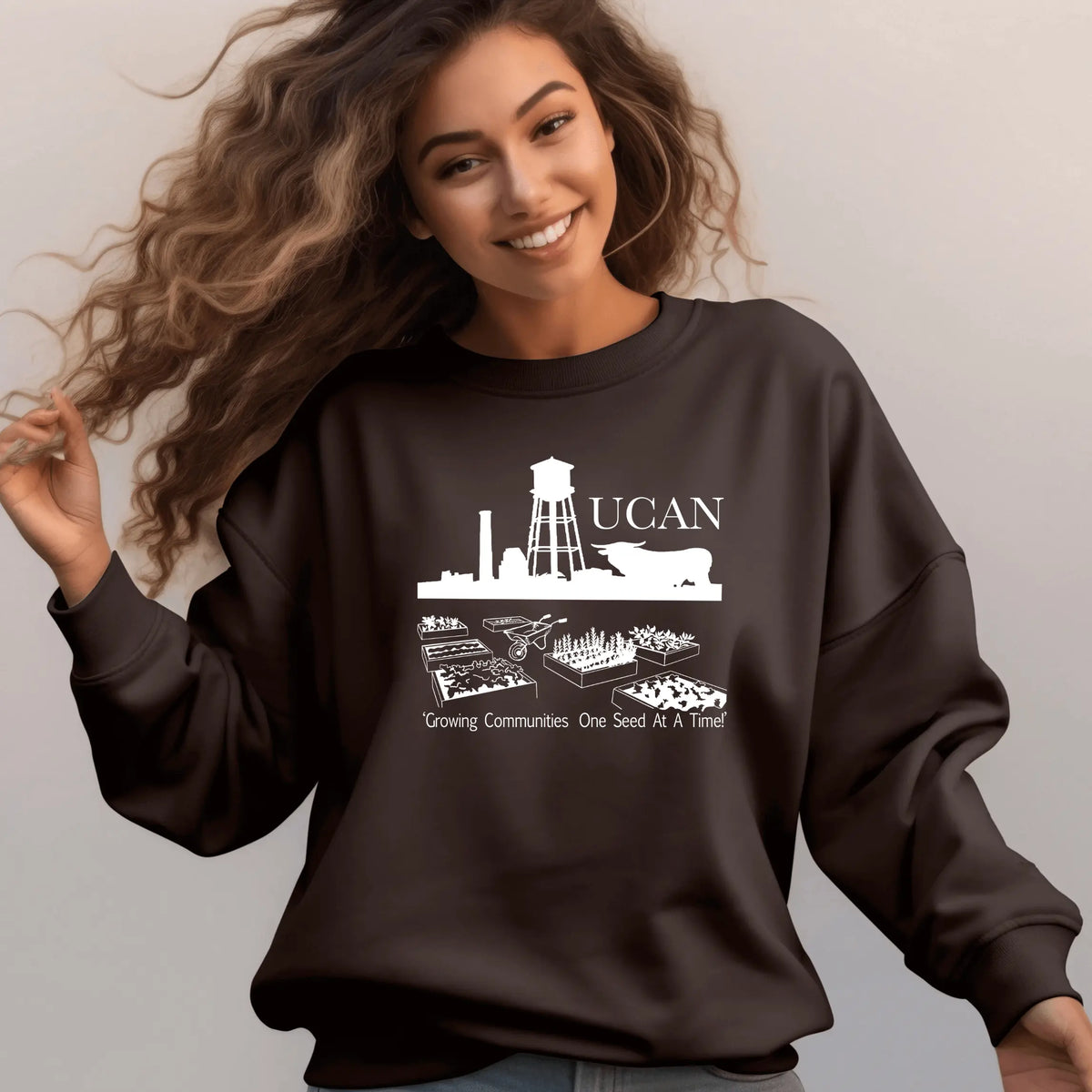 Brown UCAN crewneck sweatshirt by Winks Design Studio, LLC, shown with a comfortable fit and casual style.