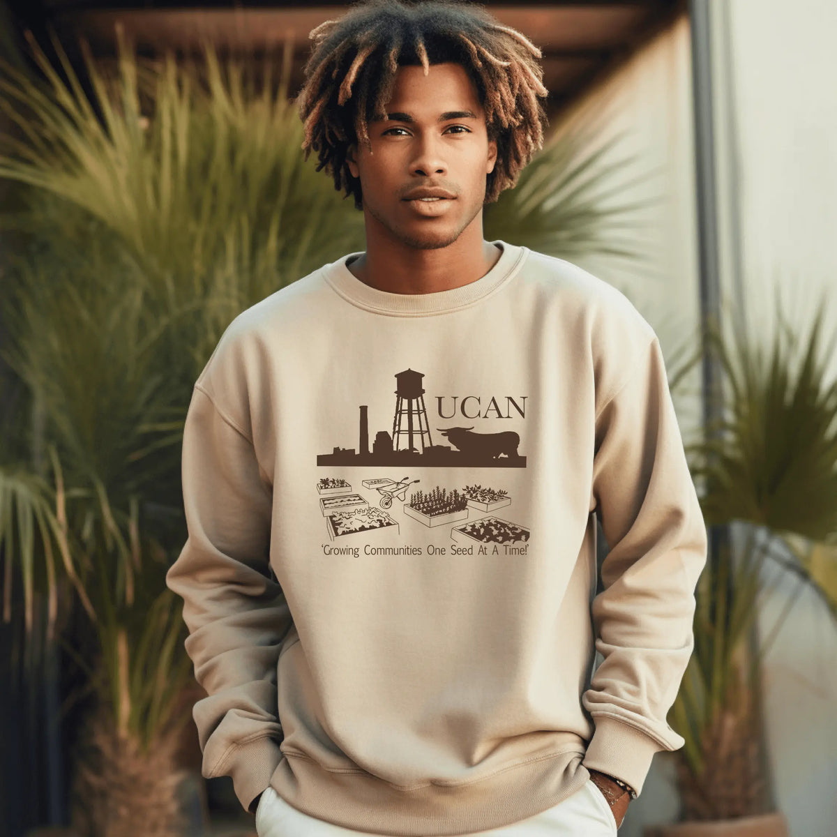 Brown UCAN crewneck sweatshirt by Winks Design Studio, LLC, featuring a comfortable crewneck design and soft fabric.