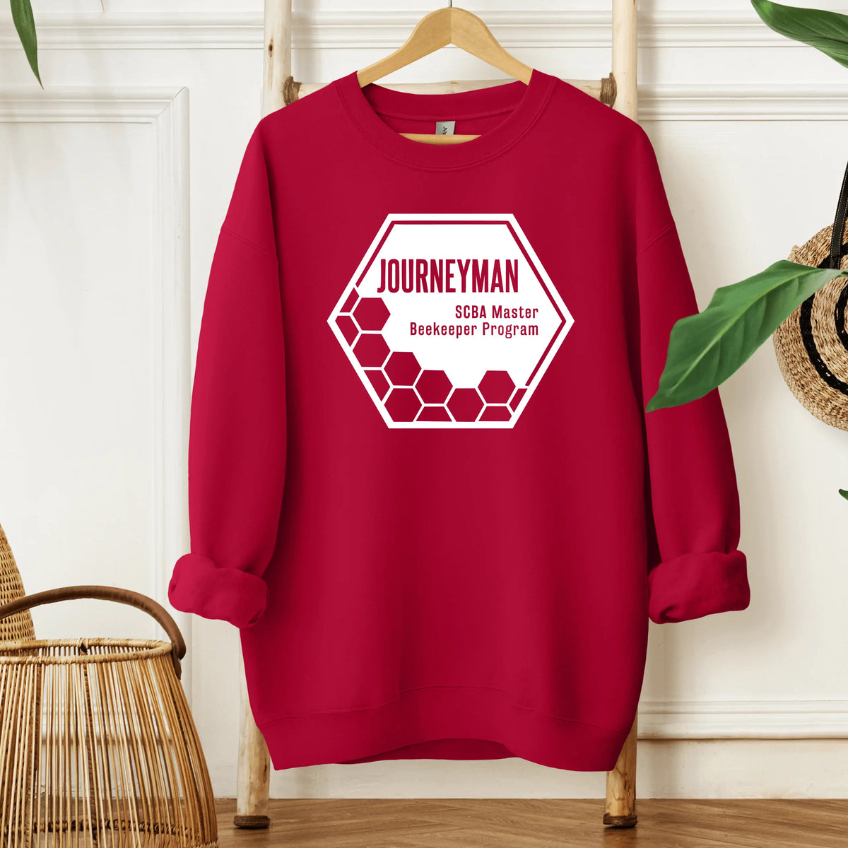 Winks Design Studio LLC SCBA Master Beekeeper Program crewneck in black with embroidered bee and text design.