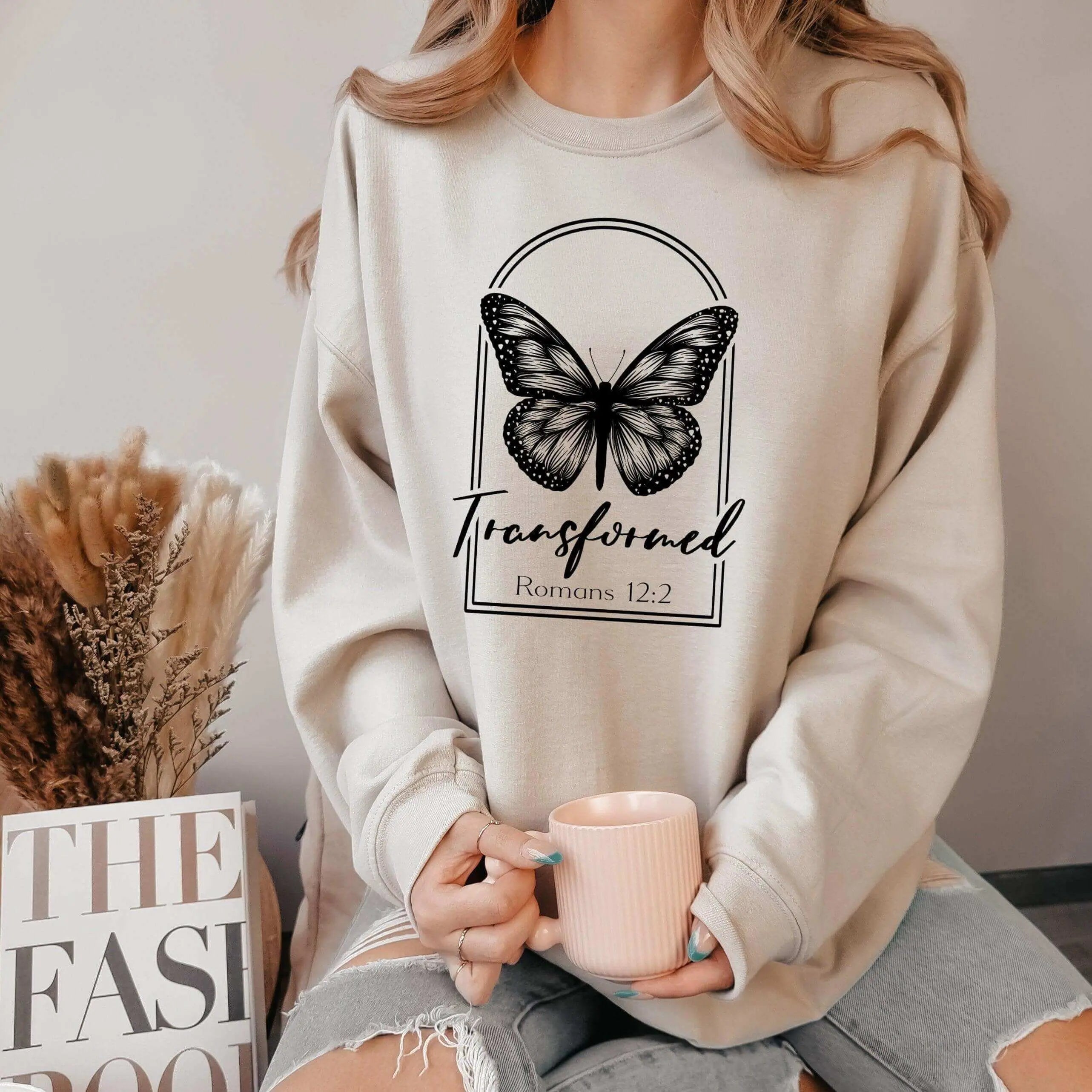 Butterfly crewneck sweatshirt by Winks Design Studio featuring transformed Romans 12:2 design on a cozy crewneck sweatshirt.