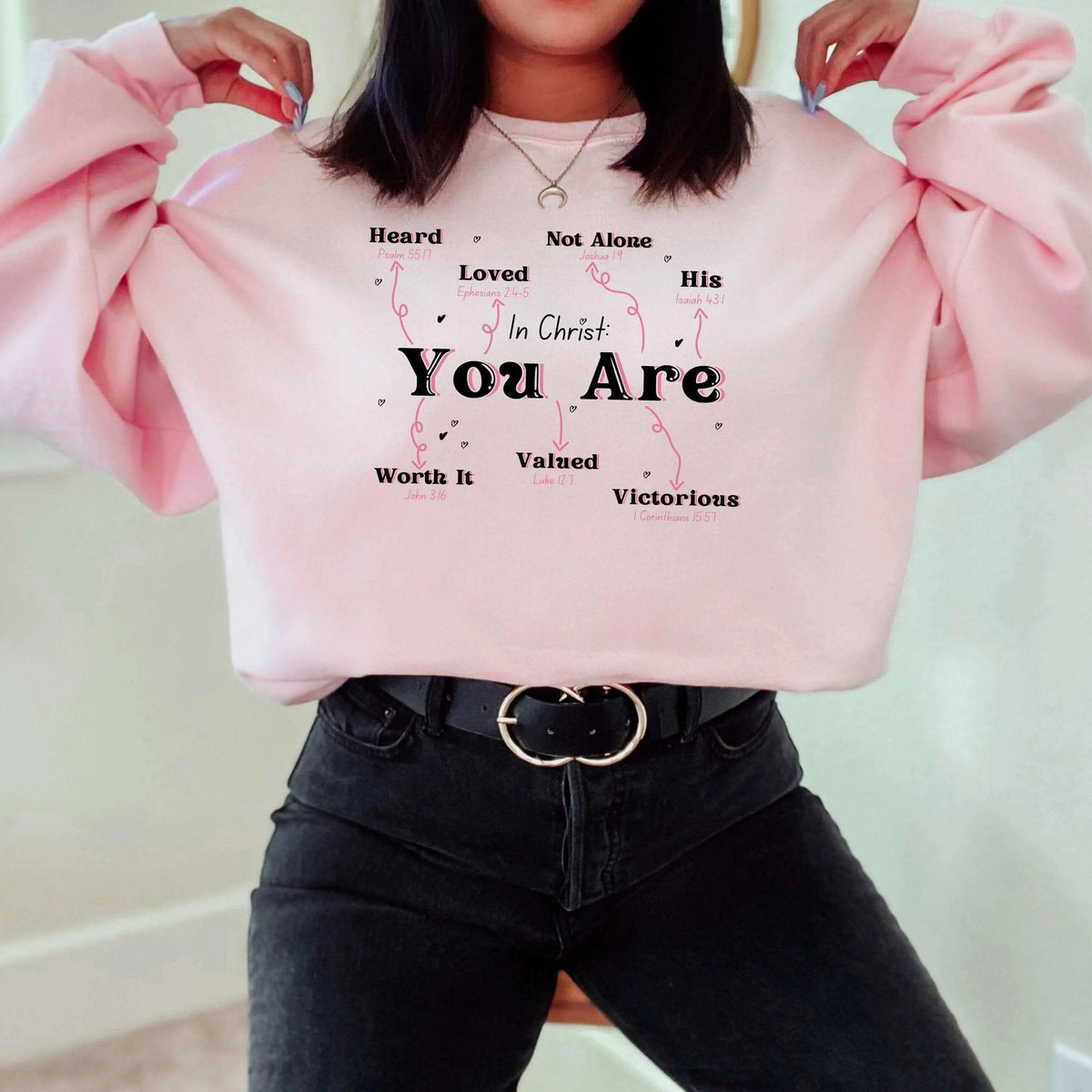 Winks Design Studio In Christ You Are crewneck sweatshirt with inspirational text, black fabric, and a comfortable fit.