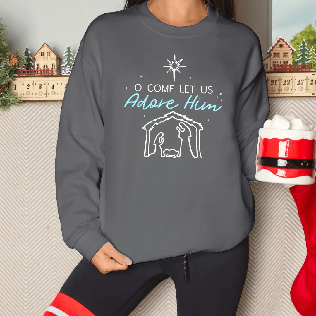 Winks Design Studio LLC O Come Let Us Adore Him Nativity crewneck sweatshirt featuring festive holiday design and soft fabric.
