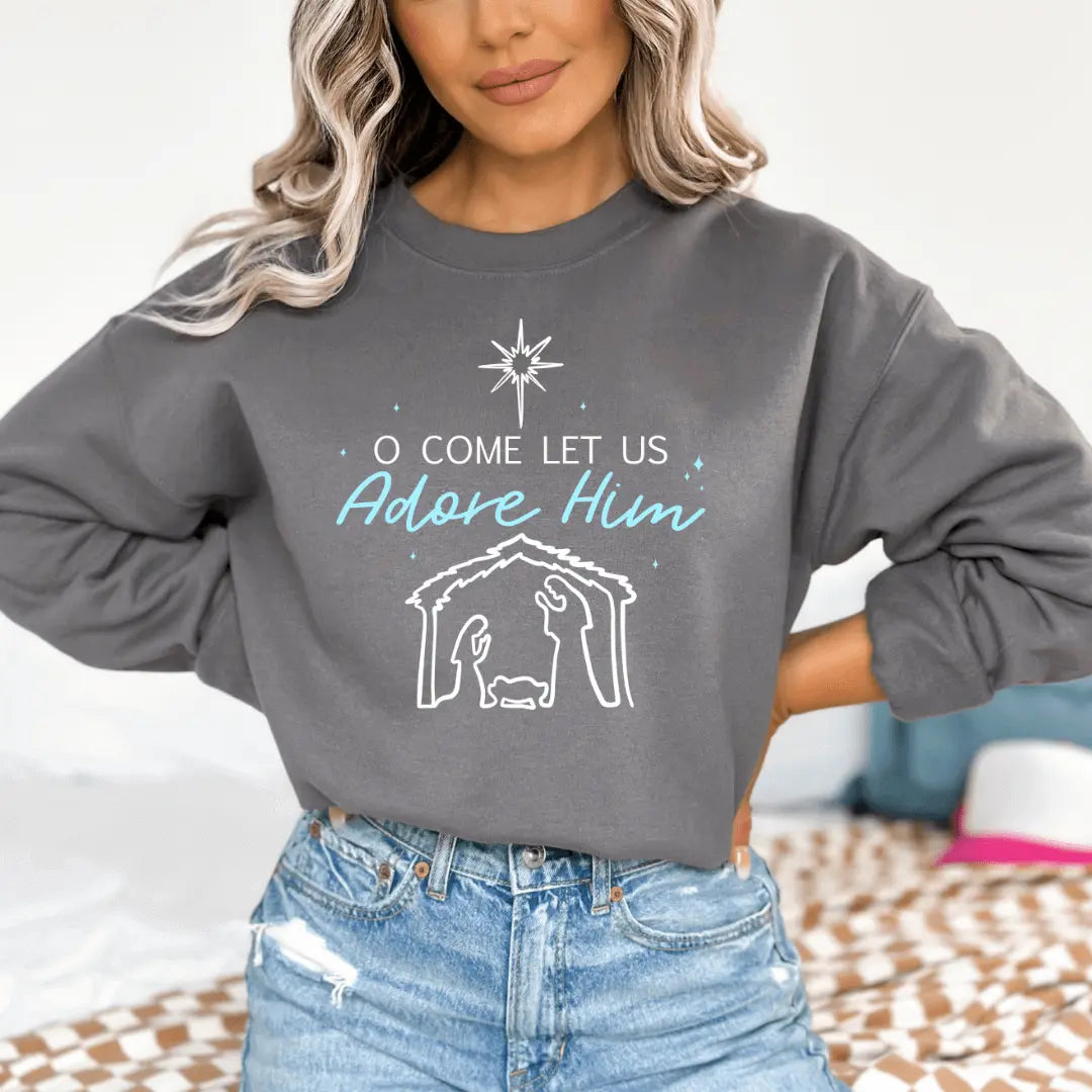 Winks Design Studio LLC nativity crewneck sweatshirt featuring festive "O Come Let Us Adore Him" design, cozy and stylish.