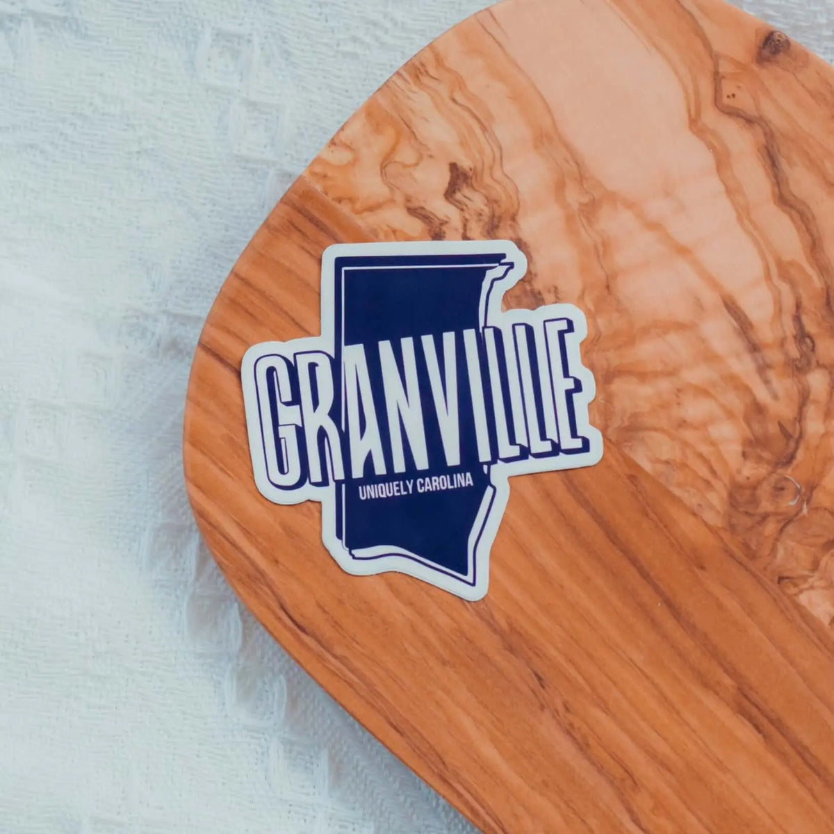 Granville NC Uniquely Carolina decorative sticker from Winks Design Studio LLC, featuring a colorful map and local design elements.