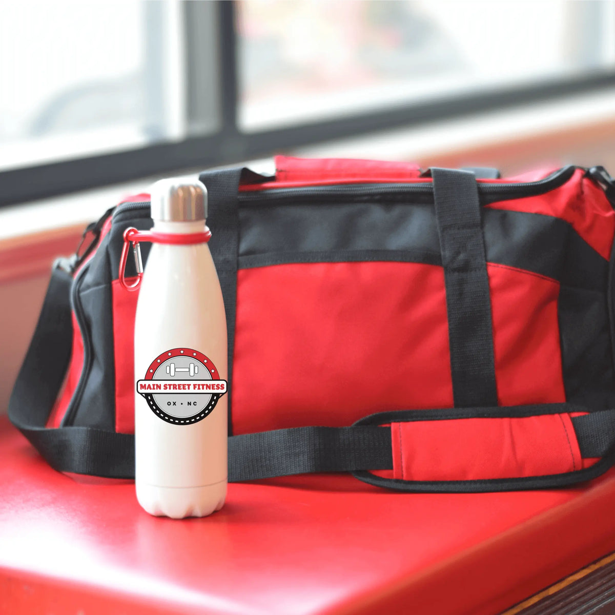 Main Street Fitness 17oz tumbler by Winks Design Studio, LLC, showing the insulated drinkware with a colorful design.