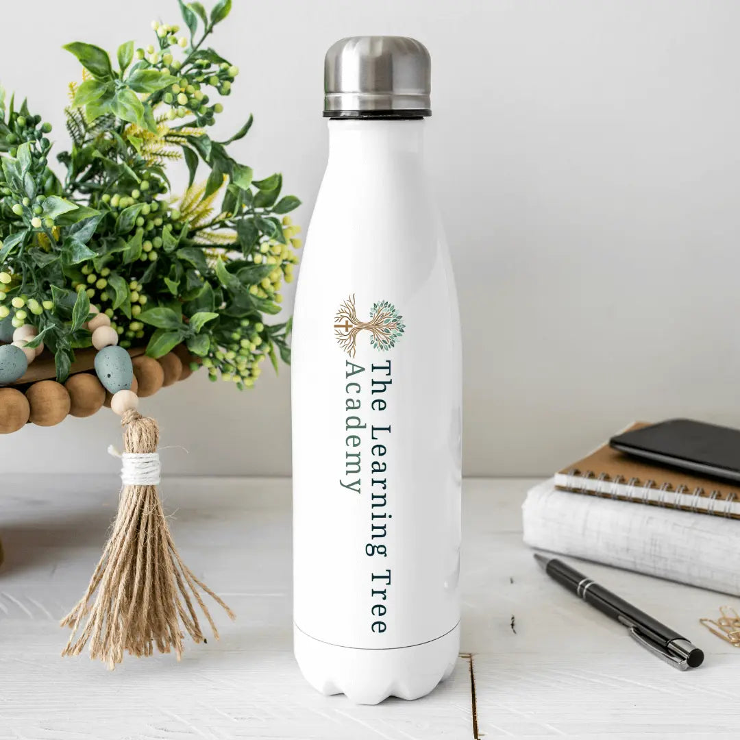 Winks Design Studio LLC The Learning Tree Academy 17oz tumbler, insulated drinkware with a colorful educational design.