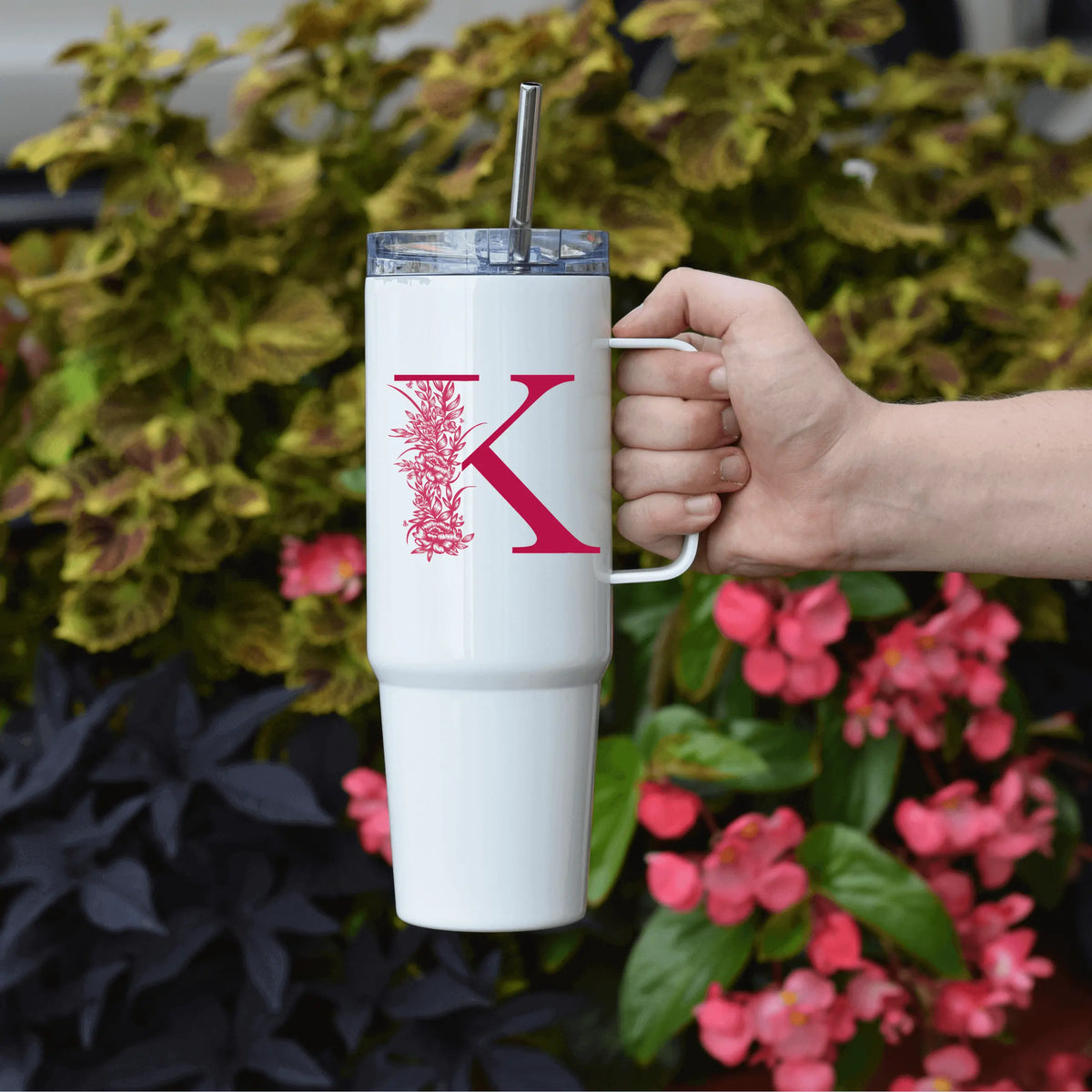 Pink floral letter 40oz tumbler with handle from Winks Design Studio, LLC, designed for beverages and custom personalization.