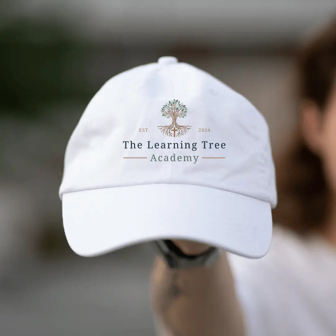 Winks Design Studio LLC The Learning Tree Academy twill hat featuring a classic baseball cap style and embroidered logo.