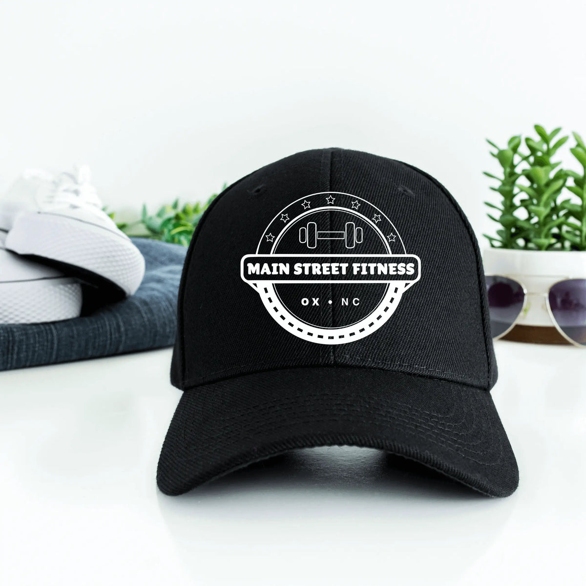 White Main Street Fitness Twill Hat by Winks Design Studio, LLC, featuring a classic baseball cap style with embroidered logo.