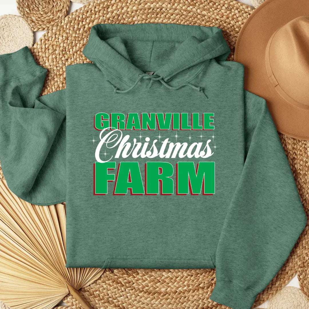 Black Granville Christmas Farm hoodie by Winks Design Studio featuring a front pouch and festive holiday design.