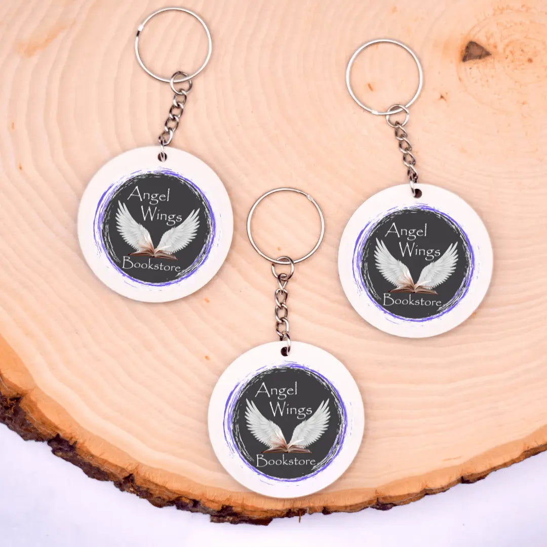 Angel Wings Bookstore Keychain by Winks Design Studio, LLC featuring a detailed angel wing charm on a metal keychain.