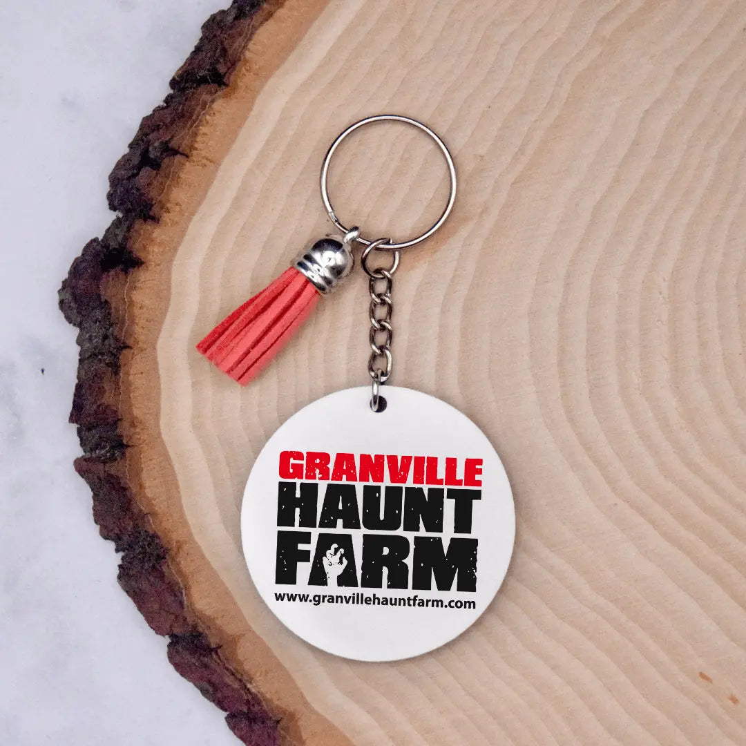 Granville Haunt Farm keychain from Winks Design Studio, LLC featuring a detailed Farm-themed design on a metal keychain.