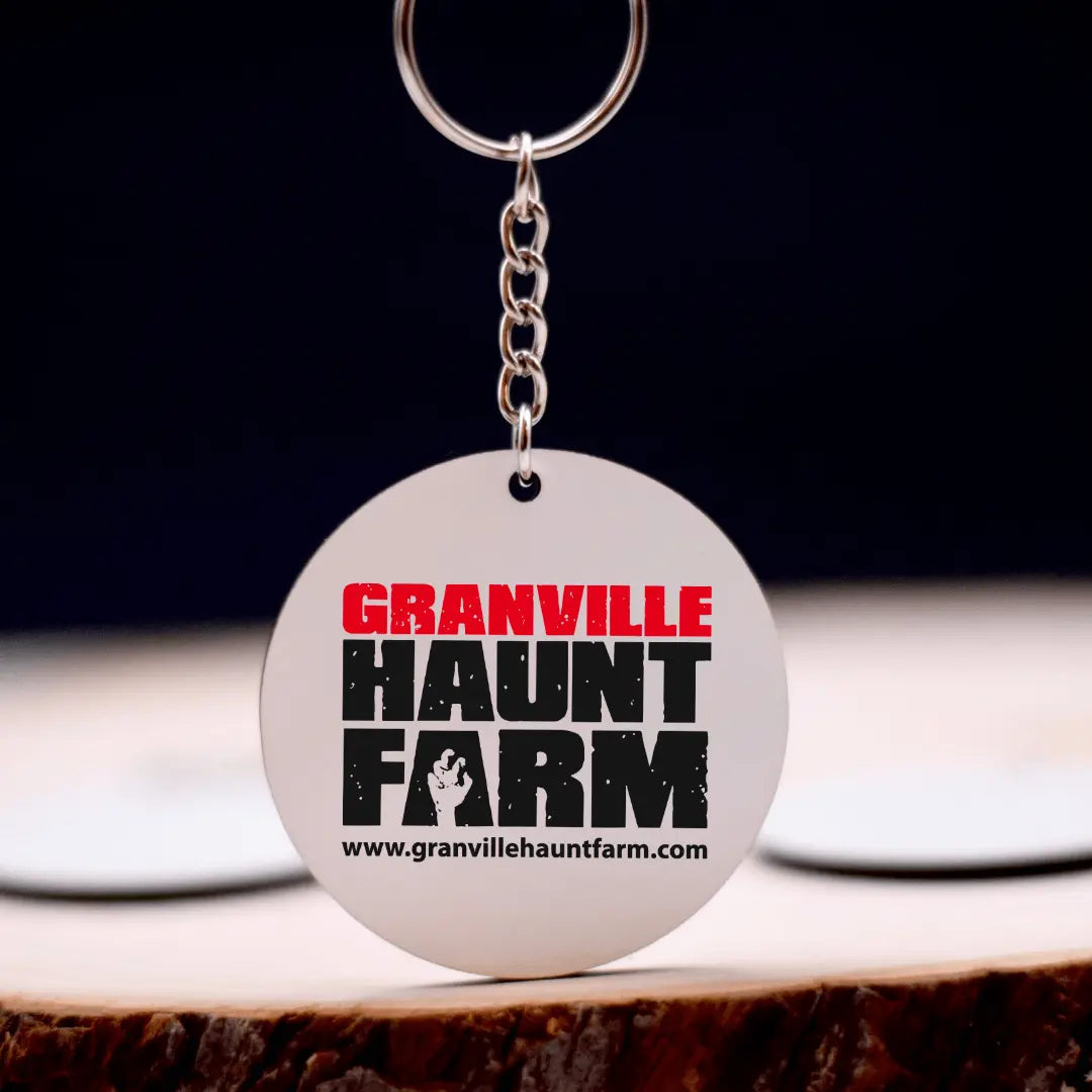 Winks Design Studio LLC Granville Haunt Farm keychain with Halloween-themed design and detailed illustration.