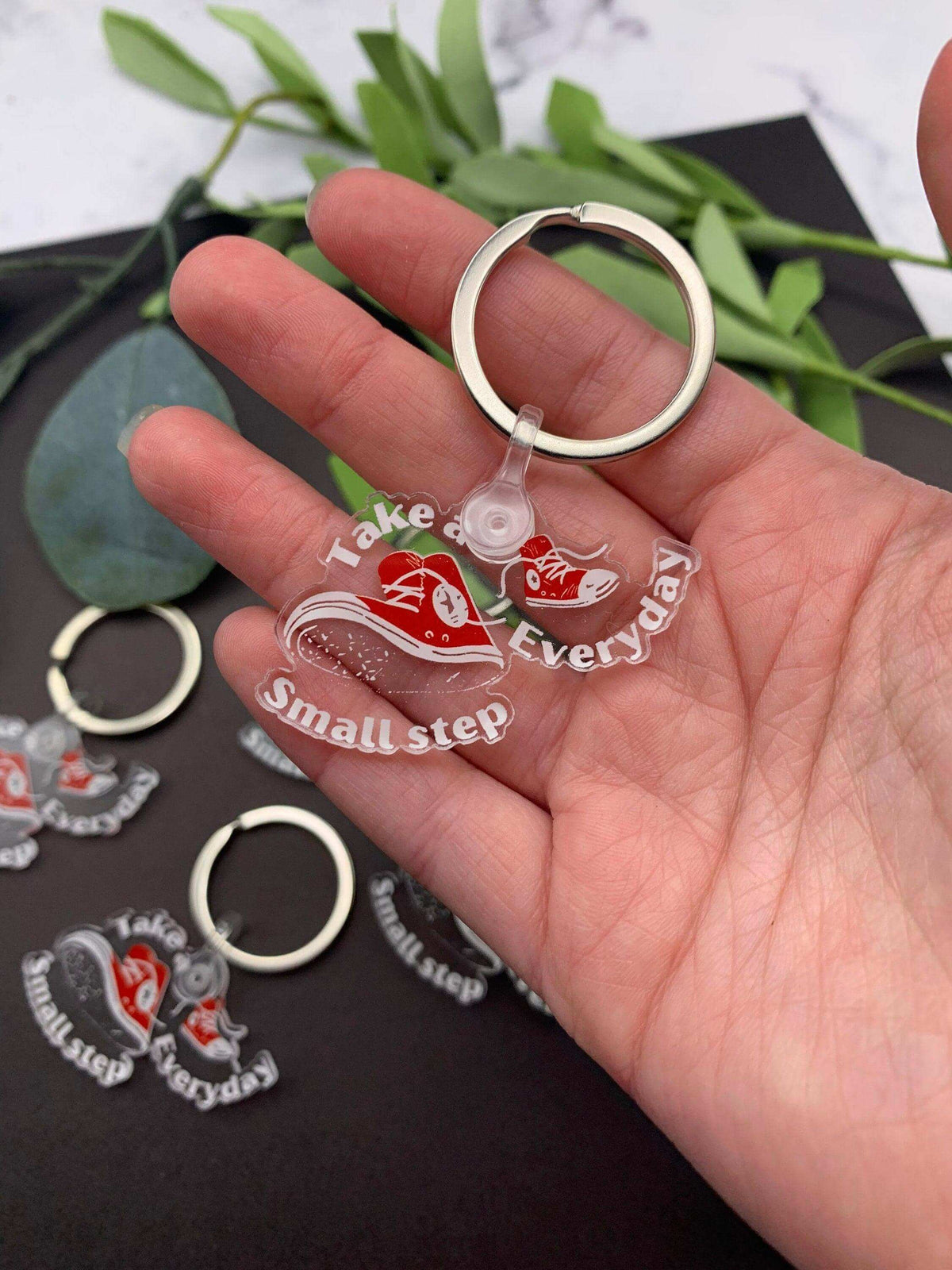 Converse high-top sneaker keychain by Winks Design Studio, LLC, featuring detailed sneaker design and keyring attachment.