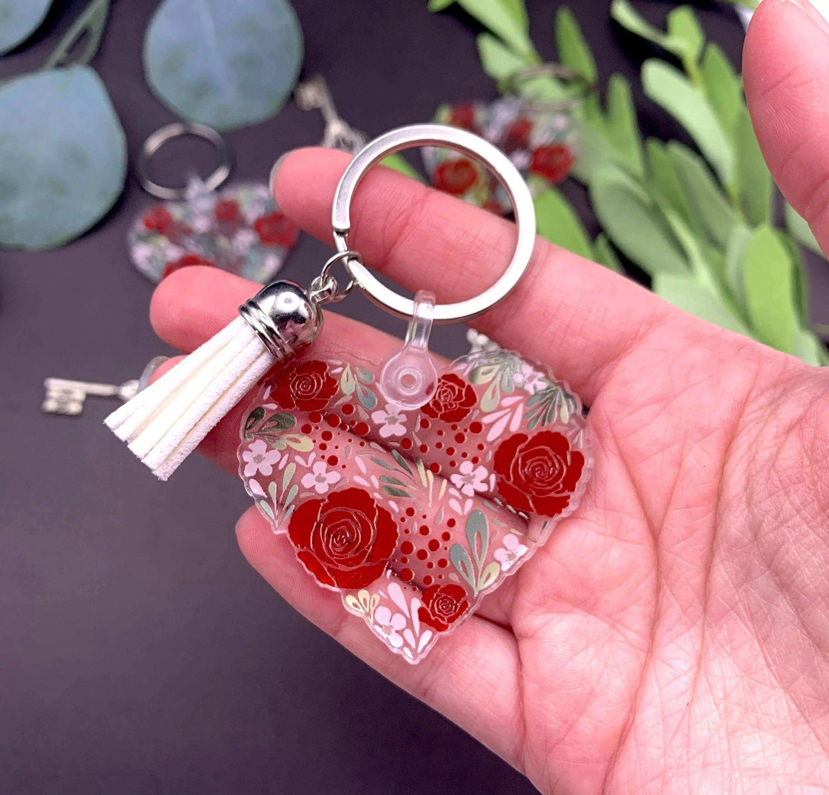 Vintage flower heart keychain by Winks Design Studio, LLC featuring a charming floral design on a metal keyring.