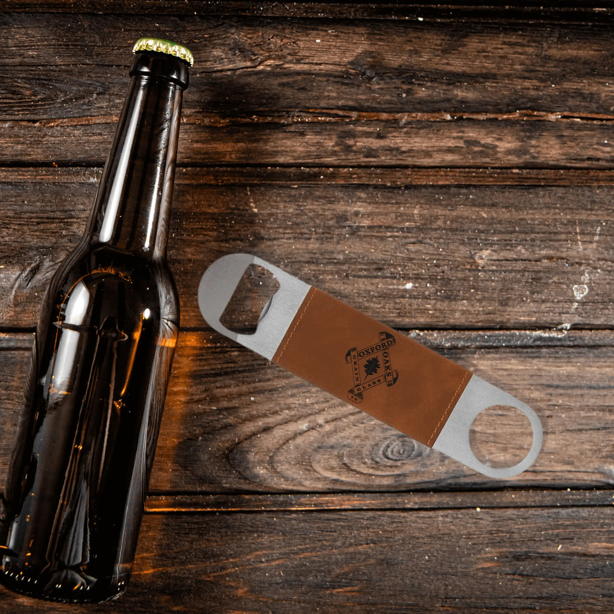 Leather bottle opener with Oxford Oaks Distillery logo, crafted by Winks Design Studio, LLC, featuring a sleek leather design.