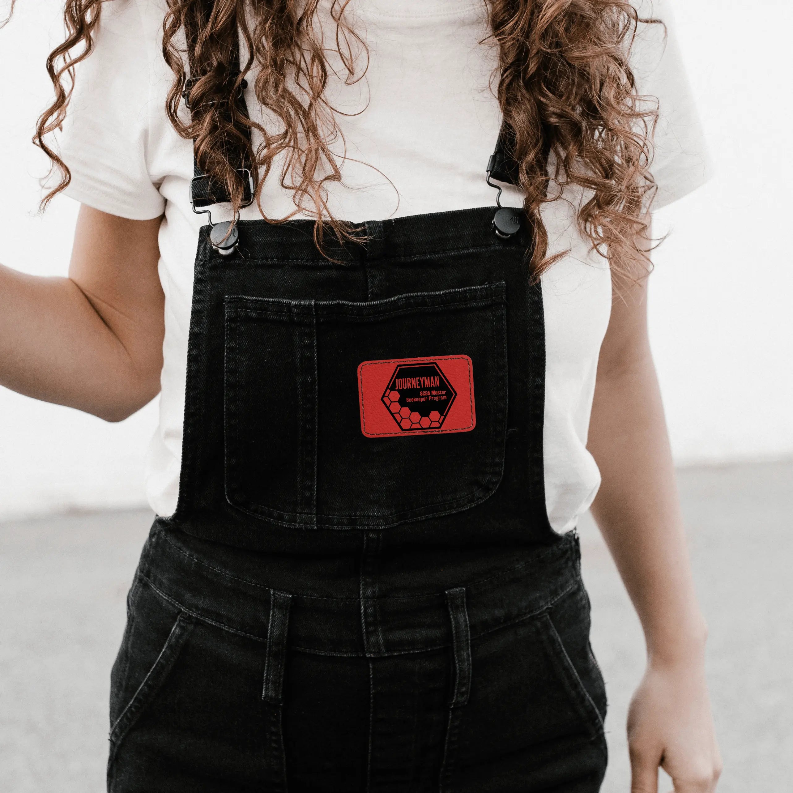 Winks Design Studio LLC SCBA Master Program leather patch featuring detailed embossed design on natural leather surface.