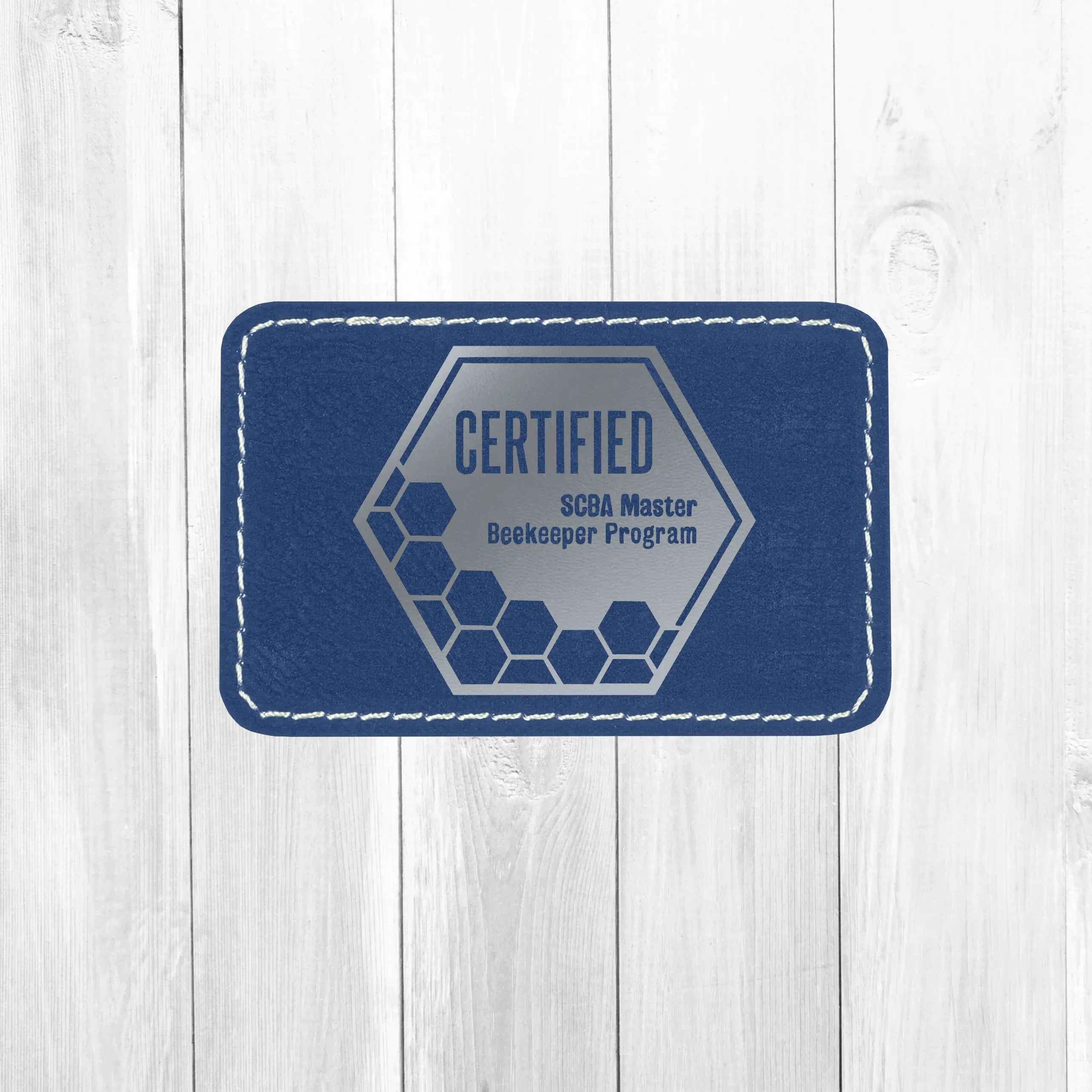 Winks Design Studio LLC SCBA Master Program leather patch with detailed embroidery and certified badge design.
