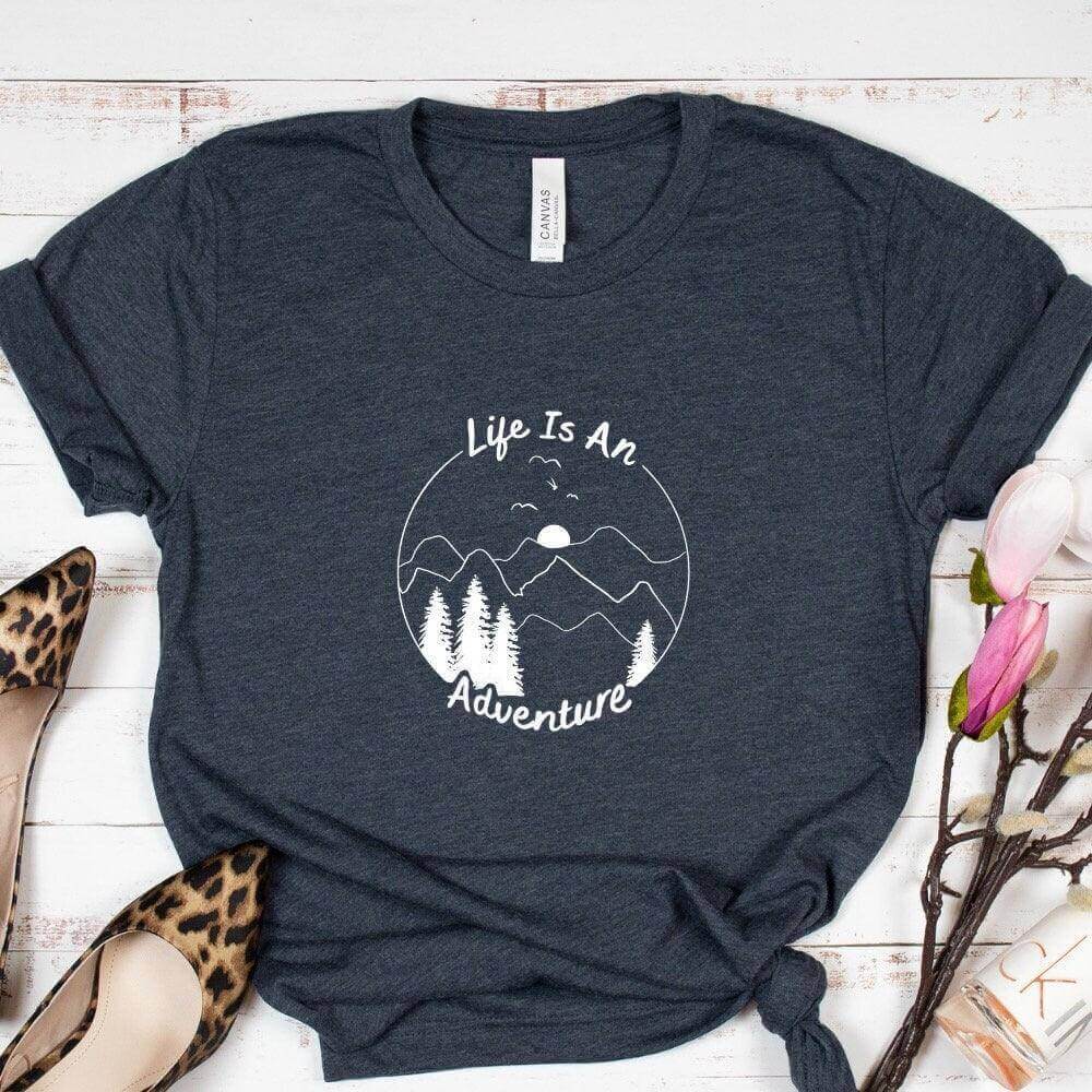 Black long sleeve shirt by Winks Design Studio with "Life is an Adventure" slogan, casual and comfortable for everyday wear.