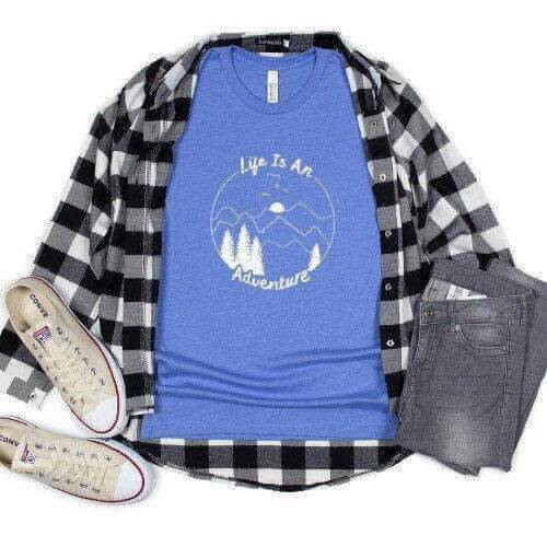 Black long sleeve shirt by Winks Design Studio with "Life is an Adventure" print, casual and comfortable for everyday wear.