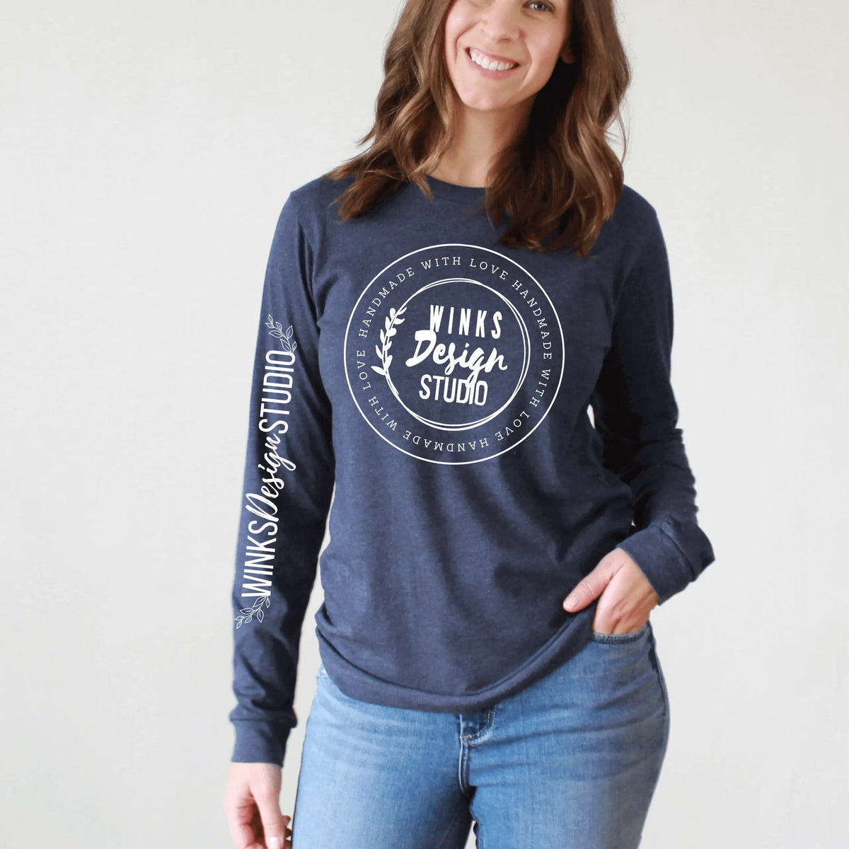 Forest green Winks Design Studio LLC long sleeve shirt featuring the WDS logo on the front.