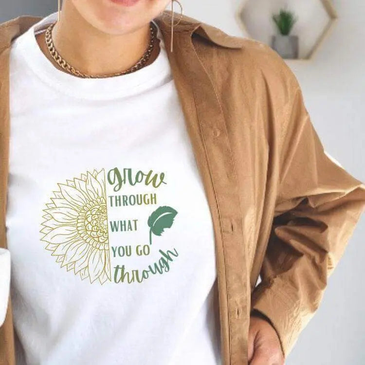 Winks Design Studio long sleeve shirt with "Grow Through What You Go Through" printed on the front, casual and comfortable fit.