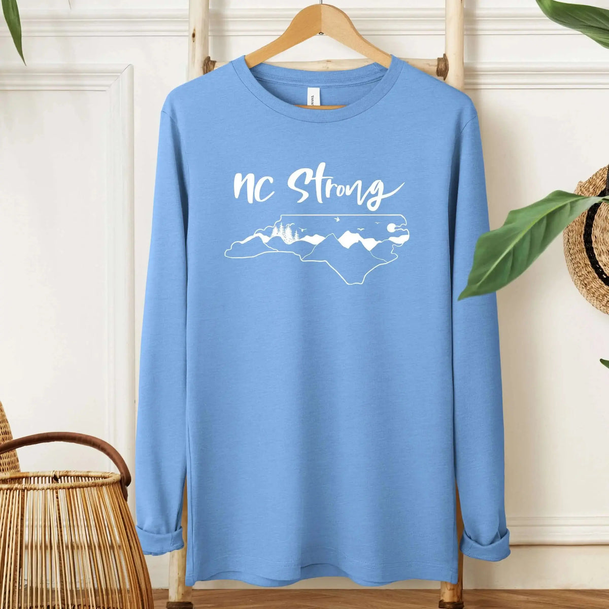 Winks Design Studio LLC NC Strong long sleeve shirt in small size, featuring a comfortable long sleeve design with printed graphics.