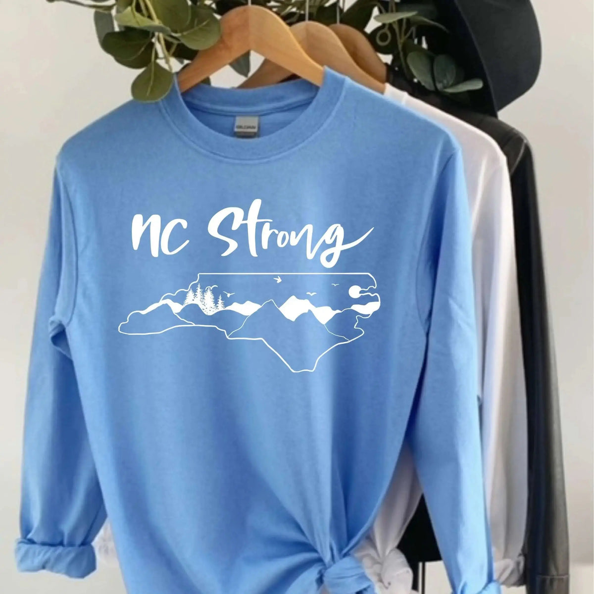 Winks Design Studio LLC NC Strong long sleeve shirt in small size, featuring a casual long sleeve with bold text design.
