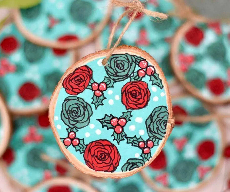 Hand-painted wooden Christmas tree ornament featuring red roses by Winks Design Studio, LLC.