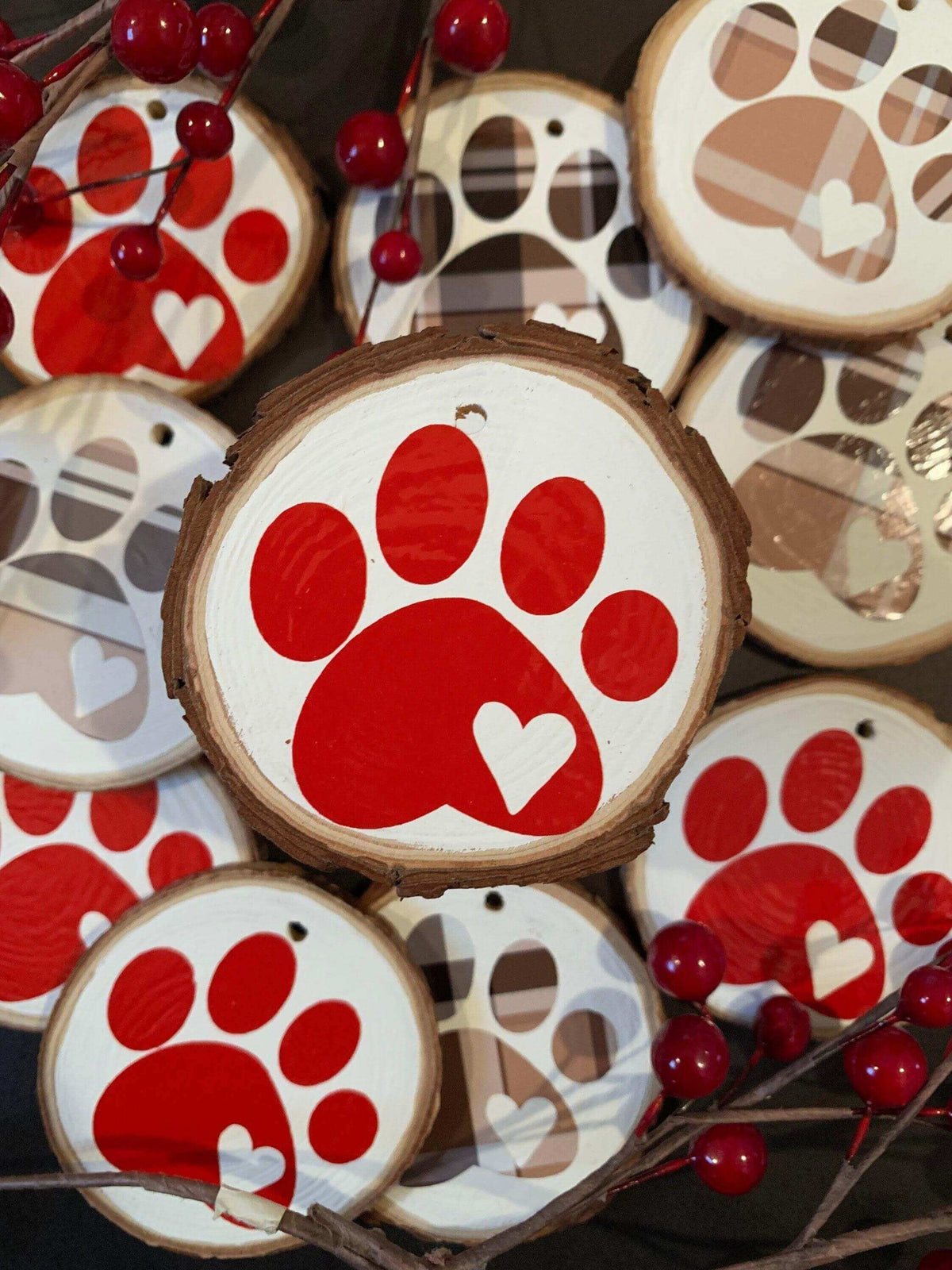 Brown plaid Christmas tree ornament with a paw print design by Winks Design Studio, LLC, ideal for holiday decorating.