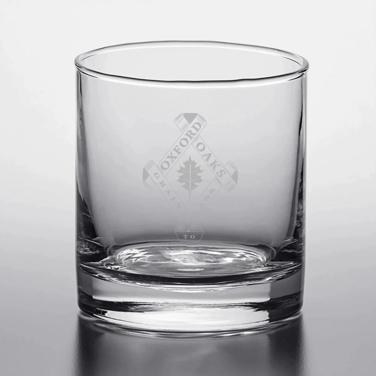 Winks Design Studio LLC Oxford Oaks Distillery Rocks Glass, single clear glass with engraved logo for spirits and cocktails