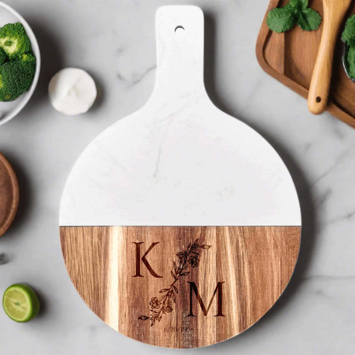 Personalized Acacia wood and marble serving board with handle by Winks Design Studio, LLC, featuring a stylish, natural wood and marble design.